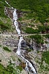 Waterfall In Glacier National Park Stock Photo