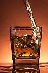 Whiskey Splash In A Glass Stock Photo