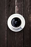 White Coffee Cup With Black Coffee On Wood Background Stock Photo