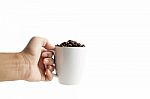 White Cup With Coffee Beans Isolated Stock Photo