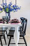 White Dinning Table With Black Chair In Dinning Room Stock Photo