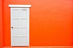 White Door Classic Vintage On The Color Red Wall Background Stock Photo