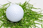 White Golf Ball On Fresh Grass Stock Photo