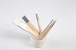 White Paintbrushes With Wooden Handle In Jar Stock Photo