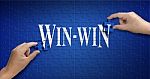 Win Win Word On Jigsaw Puzzle. Man Hand Holding A Blue Puzzle To Stock Photo