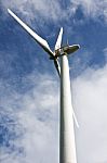 Wind Turbine In Cloudy Stock Photo