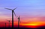 Wind Turbine Silhouette On Colorful Sunset Stock Photo