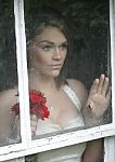 Wistful Bride At Window Stock Photo