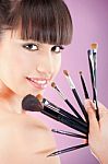 Woman And Make Up Brushes Stock Photo