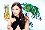 Woman And Pineapple Stock Photo