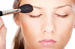 Woman Applying Make Up With Brush Stock Photo