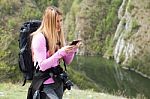 Woman At Mountain  On Mobile Phone Stock Photo