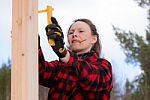 Woman Measuring On A Construction Stock Photo