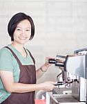 Woman Barista At Work In Coffee Shop Stock Photo