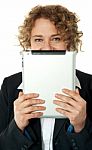 Woman Behind Ipad Stock Photo