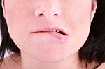 Woman Biting On Her Lip Stock Photo