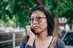 Woman Calling With Mobile Phone Disappointed On Somethings Stock Photo