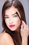 Woman Combing Eyebrow Stock Photo