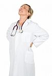 Woman Doctor With Back Pain Stock Photo