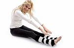 Woman Doing Stretching Exercise Stock Photo