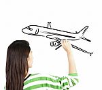 Woman Drawing Plane On Board Stock Photo