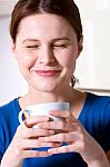 Woman Drinking A Cup Of Tea Stock Photo