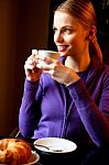 Woman Drinking Cappuccino Stock Photo
