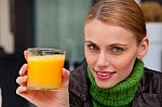 Woman Drinking Orange Juice Stock Photo