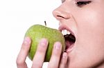 Woman Eating An Apple Stock Photo