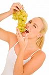 Woman Eating Grapes Stock Photo