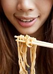 Woman Eating Noodles Stock Photo