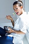 Woman Eating Salad At Home Stock Photo