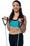 Woman Exercising With A Resistance Band Stock Photo