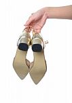 Woman Hand Holding Dress Gold High Heels Shoe Stock Photo