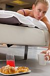 Woman Having Breakfast In Bed Stock Photo