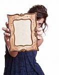 Woman Hiding Face With An Picture Frame Stock Photo