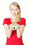 Woman Holding Baby Shoes Stock Photo