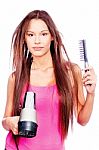 Woman Holding Blow Dryer And Comb Stock Photo
