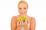 Woman Holding Grapes Stock Photo