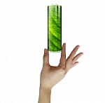 Woman Holding Green Battery Stock Photo