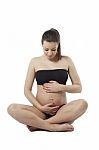 Woman Holding Her Pregnant Belly. White Background Stock Photo