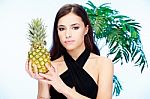 Woman Holding Pineapple Stock Photo