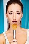 Woman Holding Powder Brush Stock Photo