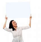 Woman Holding Up A Blank White Billboard Stock Photo