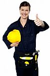 Woman In Builder Uniform Showing Thumbs Up Stock Photo
