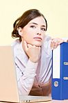 Woman In Office Near Laptop And File Stock Photo