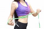 Woman In Sport Bra Measuring Her Body With Tape Isolated On Whit Stock Photo