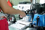 Woman Make A Cup Of Coffee By Coffee Machine Stock Photo