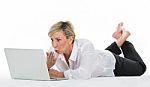 Woman Manager Sat On The Floor With Laptop Stock Photo