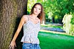 Woman On Sunny Day In Park Stock Photo